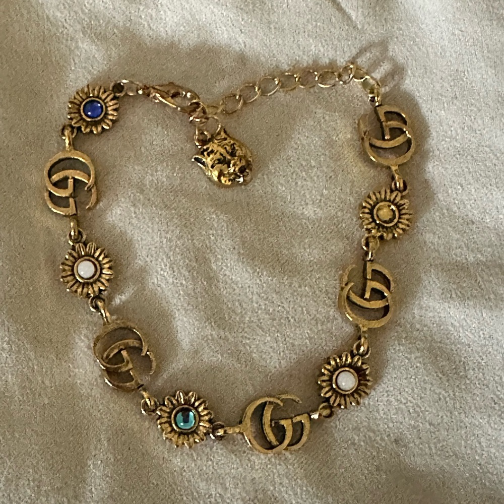 Gucci Gold and Blue Bracelet with G Charms and Sparkling Accents